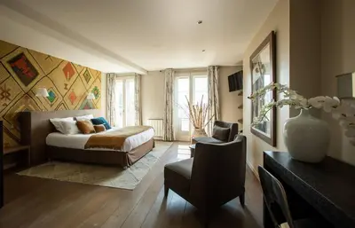 Un ou plusieurs lits dans un hébergement de l'établissement VILLA FLEURY - APPART'HÔTEL DE STANDING