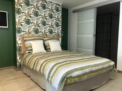 Un ou plusieurs lits dans un hébergement de l'établissement Studio neuf de 24m²