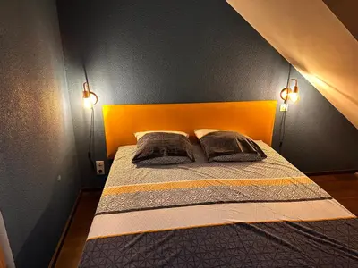 Un ou plusieurs lits dans un hébergement de l'établissement La Maison aux Volets Bleus 3ème Étage