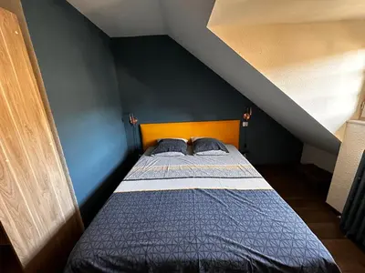 Un ou plusieurs lits dans un hébergement de l'établissement La Maison aux Volets Bleus 3ème Étage