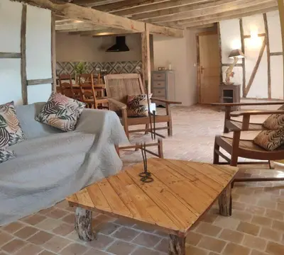 Coin salon dans l'établissement Le cottage des Acacias