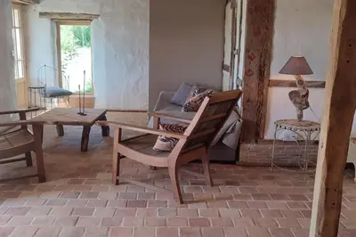 Coin salon dans l'établissement Le cottage des Acacias