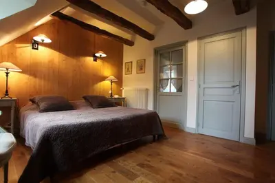 Un ou plusieurs lits dans un hébergement de l'établissement La maison Saluces