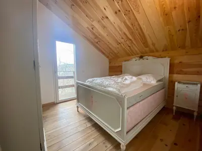 Un ou plusieurs lits dans un hébergement de l'établissement Chalet vue lac