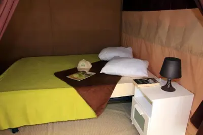 Un ou plusieurs lits dans un hébergement de l'établissement Camping 4 étoiles - Piscine - eed0fi