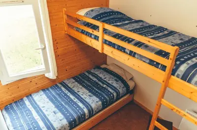 Un ou plusieurs lits dans un hébergement de l'établissement Chalet 3 étoiles - Piscine - eebbhf