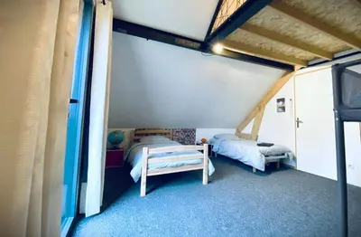 Un ou plusieurs lits dans un hébergement de l'établissement L’écrin des bois