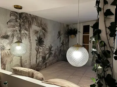 Un ou plusieurs lits dans un hébergement de l'établissement Studio Jungle-Calme rue piétonne