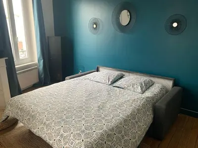Un ou plusieurs lits dans un hébergement de l'établissement Studio Cosy à 12 min à pieds de la Gare