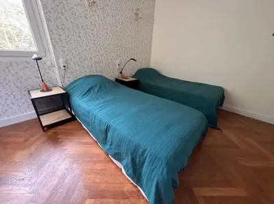 Un ou plusieurs lits dans un hébergement de l'établissement Maison Meublée Montignac-Lascaux