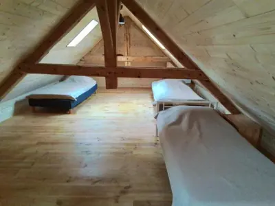 Un ou plusieurs lits dans un hébergement de l'établissement Grande maison 7 chambres