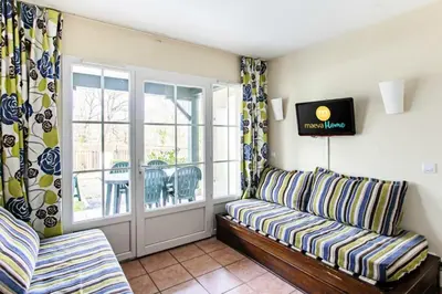 Télévision ou salle de divertissement dans l'établissement Résidence Les Belles Rives - maeva Home - Appartement 2 pièces 5 personnes - Confort MAE-4404