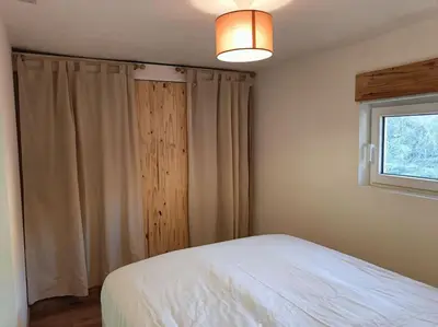Un ou plusieurs lits dans un hébergement de l'établissement Chalet au bord du lac