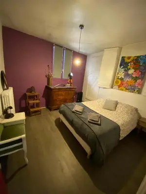 Un ou plusieurs lits dans un hébergement de l'établissement COSY B&B