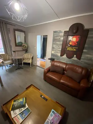 Coin salon dans l'établissement COSY B&B