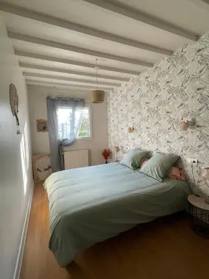 Un ou plusieurs lits dans un hébergement de l'établissement Gîte l'ancienne épicerie Meyronne