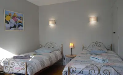 Un ou plusieurs lits dans un hébergement de l'établissement Gîte l'ancienne épicerie Meyronne