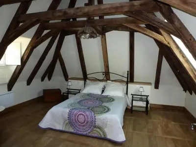 Un ou plusieurs lits dans un hébergement de l'établissement Gîte de France Chez le fustier 4 épis - Gîte de France 6 personnes MAE-8924