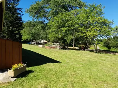 Jardin de l'établissement Gîte de France De la bergerie 2 épis - Gîte de France 4 personnes MAE-9104