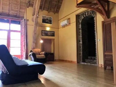 Coin salon dans l'établissement Gîte de France Villamonq 2 épis - Gîte de France 8 personnes MAE-9244