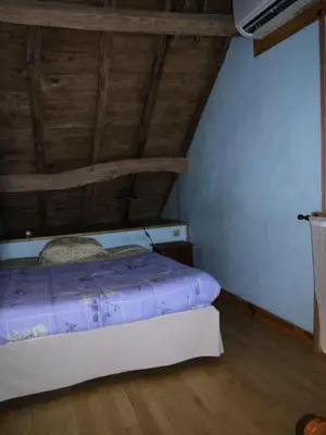 Un ou plusieurs lits dans un hébergement de l'établissement Gîte de France Villamonq 2 épis - Gîte de France 8 personnes MAE-9244