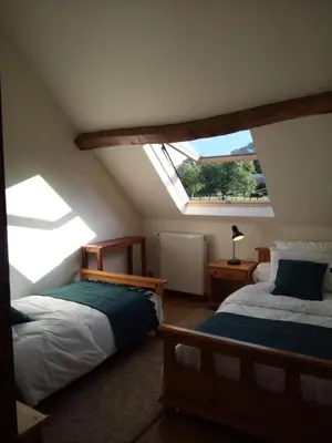 Un ou plusieurs lits dans un hébergement de l'établissement Gîte de France Gîte des papous 4 épis - Gîte de France 10 personnes MAE-9494