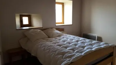 Un ou plusieurs lits dans un hébergement de l'établissement Gîte de France Maison raymond 3 épis - Gîte de France 12 personnes MAE-9804