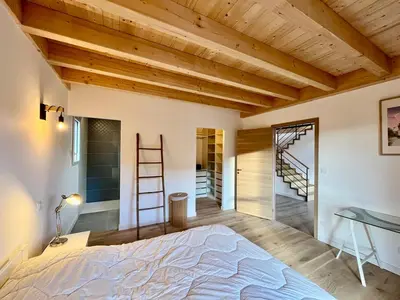 Un ou plusieurs lits dans un hébergement de l'établissement Chalet 5 pièces avec terrasse et garage au Mont-Dore - FR-1-608-263