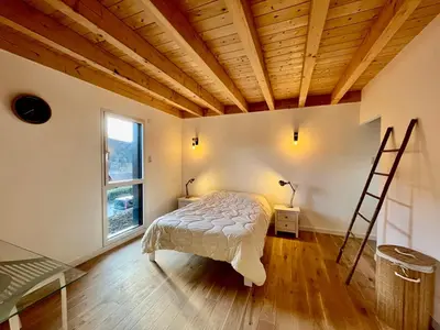 Un ou plusieurs lits dans un hébergement de l'établissement Chalet 5 pièces avec terrasse et garage au Mont-Dore - FR-1-608-263