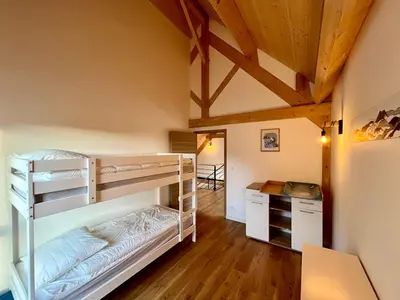 Un ou plusieurs lits dans un hébergement de l'établissement Chalet 5 pièces avec terrasse et garage au Mont-Dore - FR-1-608-263
