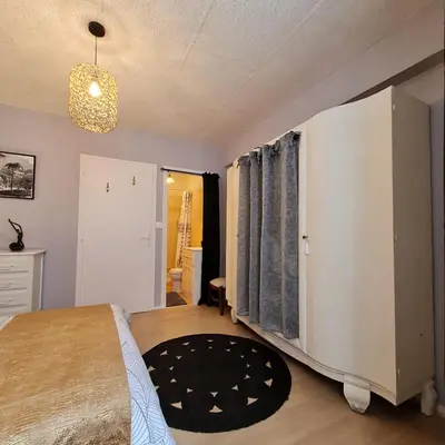 Un ou plusieurs lits dans un hébergement de l'établissement Bel appartement « Les Monts du Cantal »