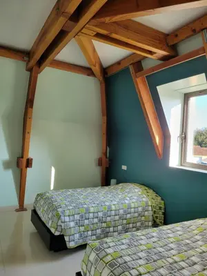Un ou plusieurs lits dans un hébergement de l'établissement La jolie Villa du Pesquier
