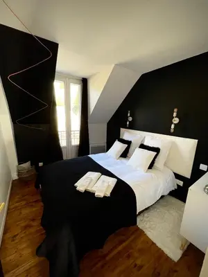 Un ou plusieurs lits dans un hébergement de l'établissement Maison Yuki - Appartement chic - Netflix et Parking gratuit
