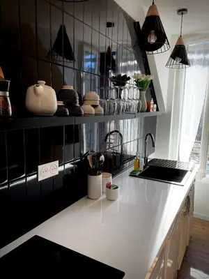 Cuisine ou kitchenette dans l'établissement Maison Yuki - Appartement chic - Netflix et Parking gratuit