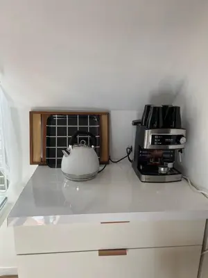Cuisine ou kitchenette dans l'établissement Maison Yuki - Appartement chic - Netflix et Parking gratuit