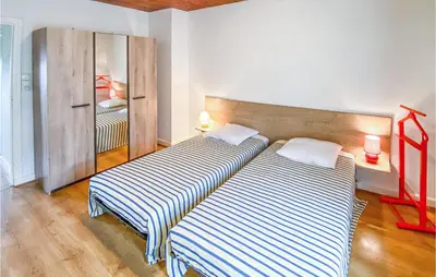 Un ou plusieurs lits dans un hébergement de l'établissement Holiday Home La Barrière - 02