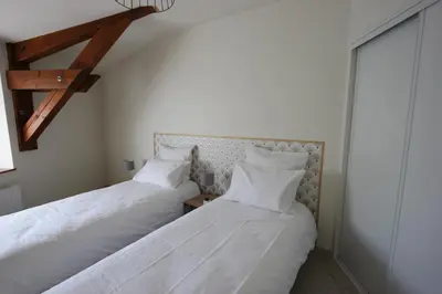 Un ou plusieurs lits dans un hébergement de l'établissement Gite de la rue du château - tout inclus