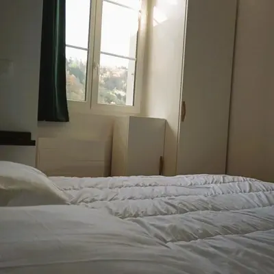 Un ou plusieurs lits dans un hébergement de l'établissement Appartement Centre Ville MONT DORE Vacances et Week-End Classé 3 Etoiles