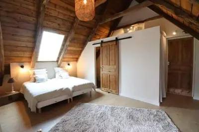 Un ou plusieurs lits dans un hébergement de l'établissement Gîte du Milan royal