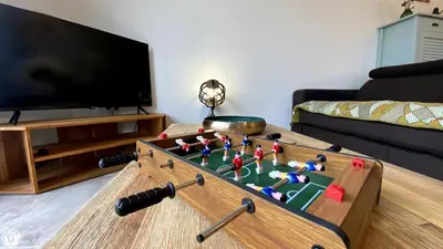 Télévision ou salle de divertissement dans l'établissement Breakislebed 3 Maisons CHU LIMOGES