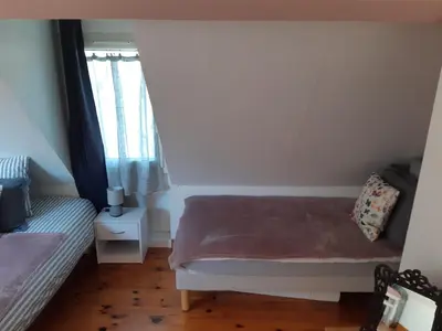 Un ou plusieurs lits dans un hébergement de l'établissement Le gîte LE MIEL du Périgord vert