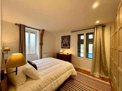 Un ou plusieurs lits dans un hébergement de l'établissement Charmant T3 au Mont-Dore, jusqu'à 4 pers, wifi, vue Puy Gros - FR-1-608-265