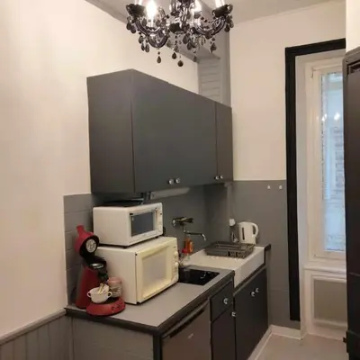 Cuisine ou kitchenette dans l'établissement Le Nid Douillet Baroque Linge fourni