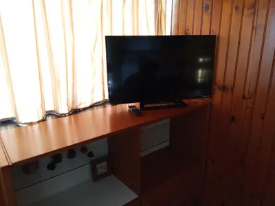 Télévision ou salle de divertissement dans l'établissement Appartement plein cœur Super-Besse
