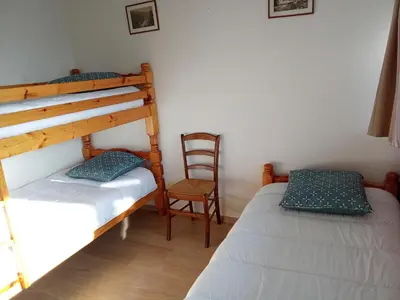 Un ou plusieurs lits dans un hébergement de l'établissement Appartement plein cœur Super-Besse