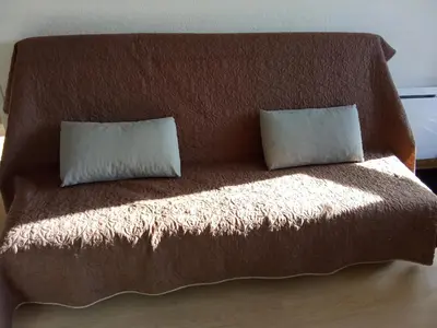 Un ou plusieurs lits dans un hébergement de l'établissement Appartement plein cœur Super-Besse