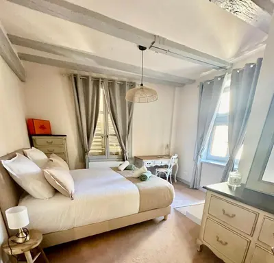 Un ou plusieurs lits dans un hébergement de l'établissement Limoges Centre Appartement de Charme