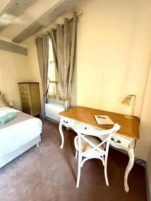 Un ou plusieurs lits dans un hébergement de l'établissement Limoges Centre Appartement de Charme