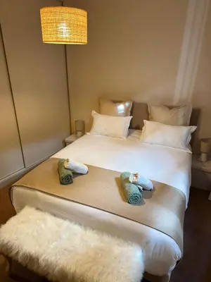 Un ou plusieurs lits dans un hébergement de l'établissement Limoges Centre Appartement de Charme