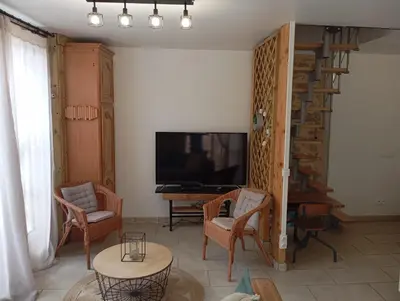 Télévision ou salle de divertissement dans l'établissement Gîte La Forge proche Rocamadour, Padirac